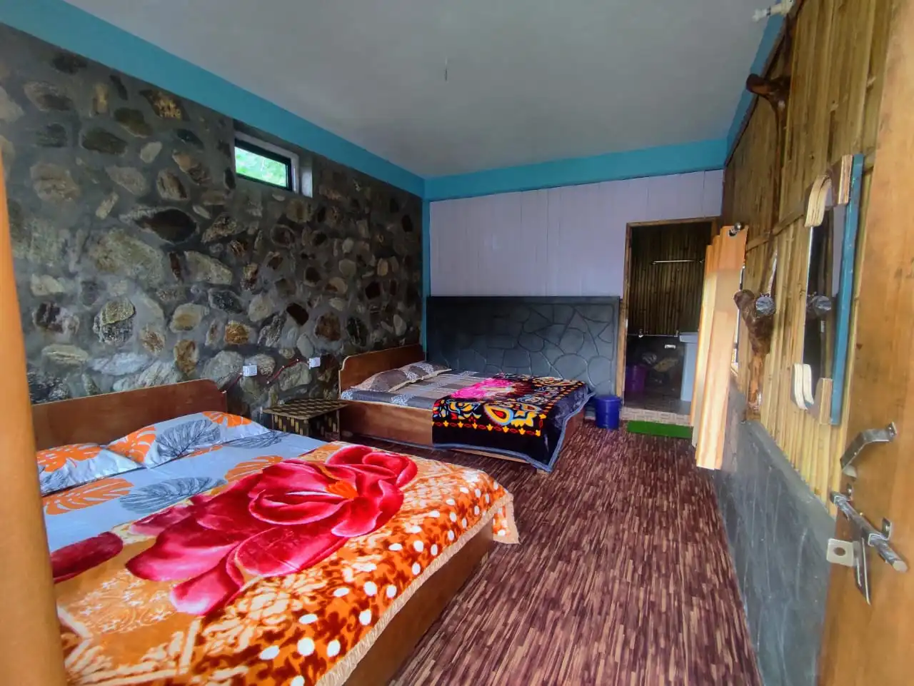 Spacious and comfortable rooms of the stone and bamboo cottage of the Newar Homestay Tabakoshi.